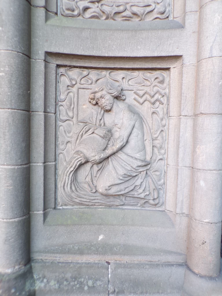 The water bearer of Aquarius decorative detail outside the side entrance of Stirling Highland Hotel, Scotland
