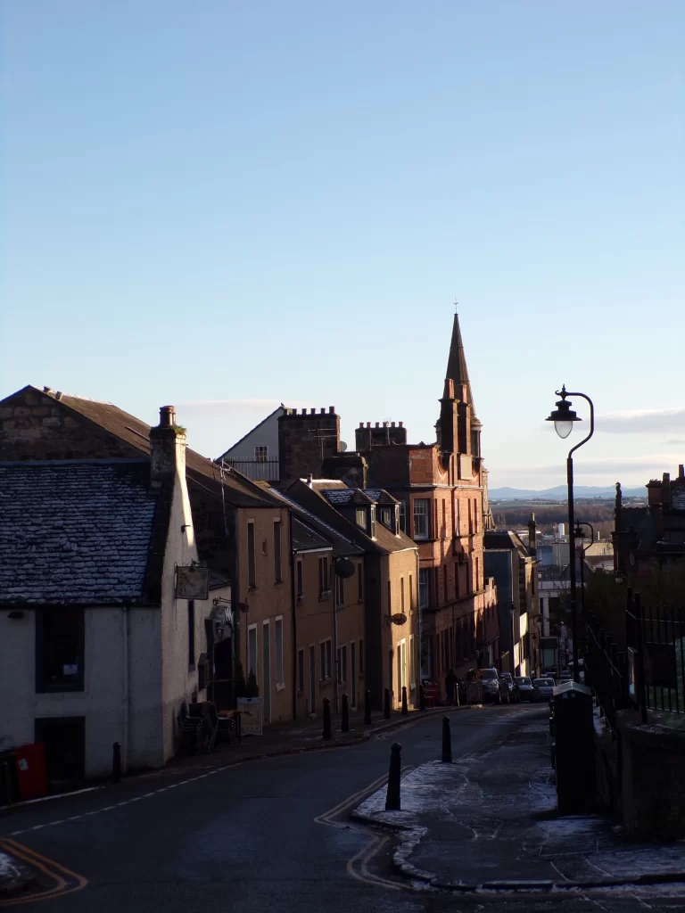 A street in Stirling with a view of the mountains in the distance
